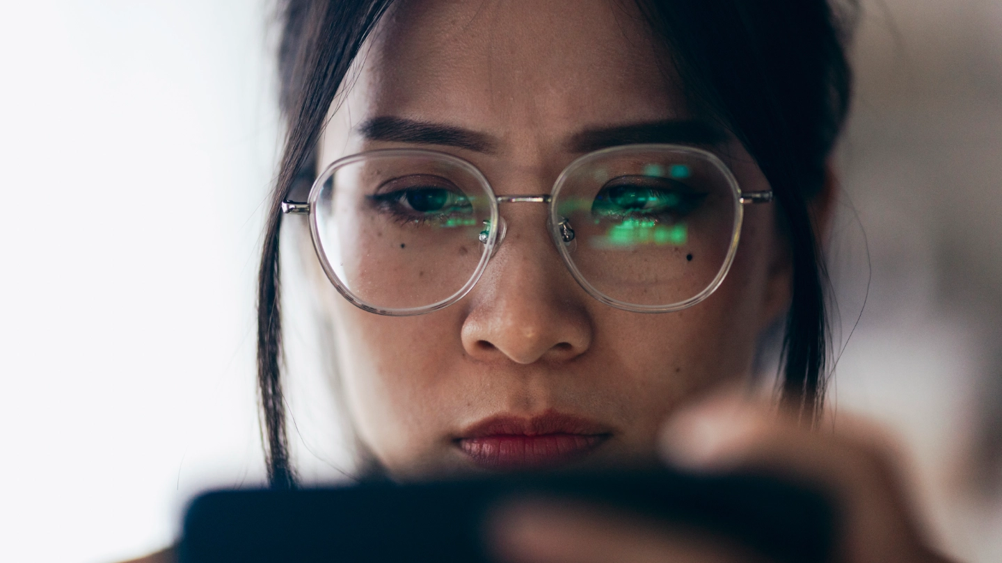 Taiwanese lady inspecting her phone image