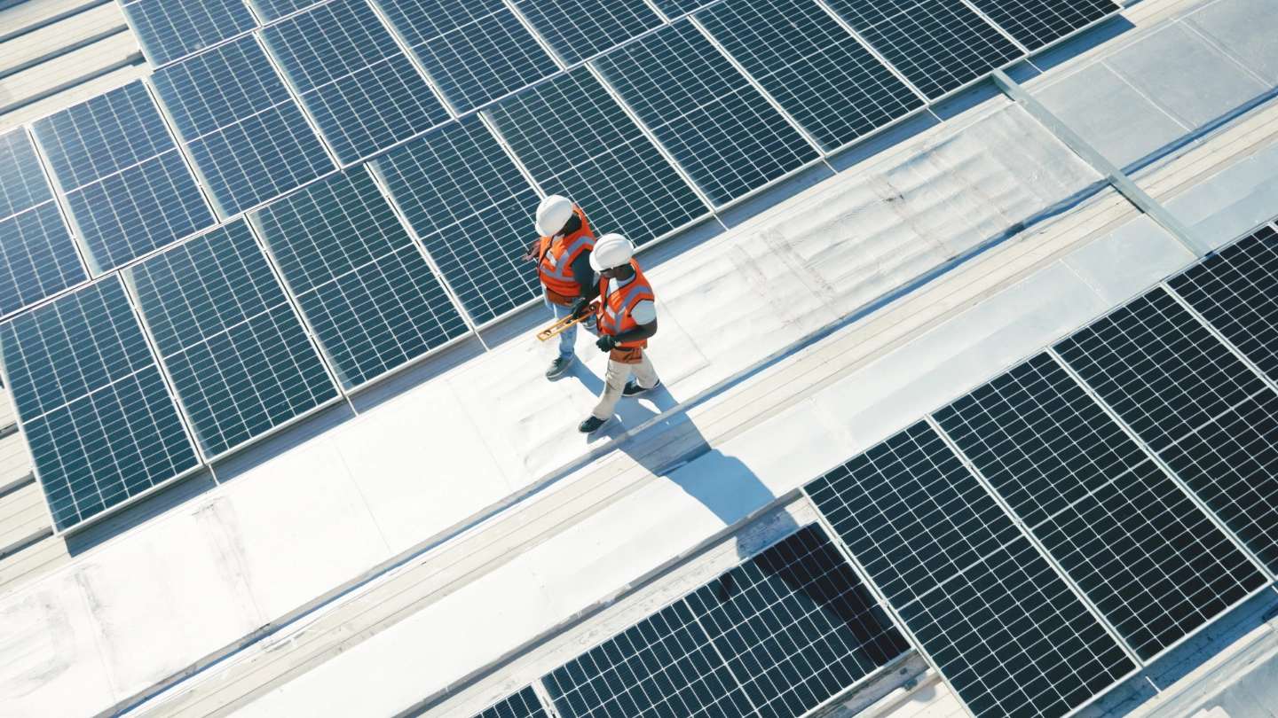 Two solar panel workers walking image