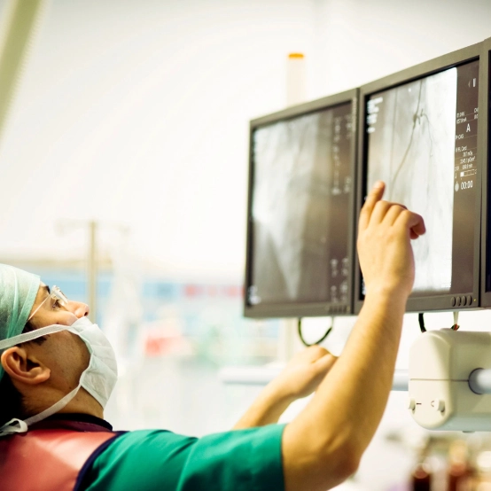 Medical equipment worker looking at screen