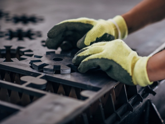 Close up of an engineer forming a metal component