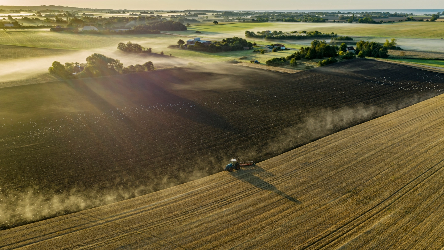 Tractor ploughing a rural field Tractor ploughing a rural field